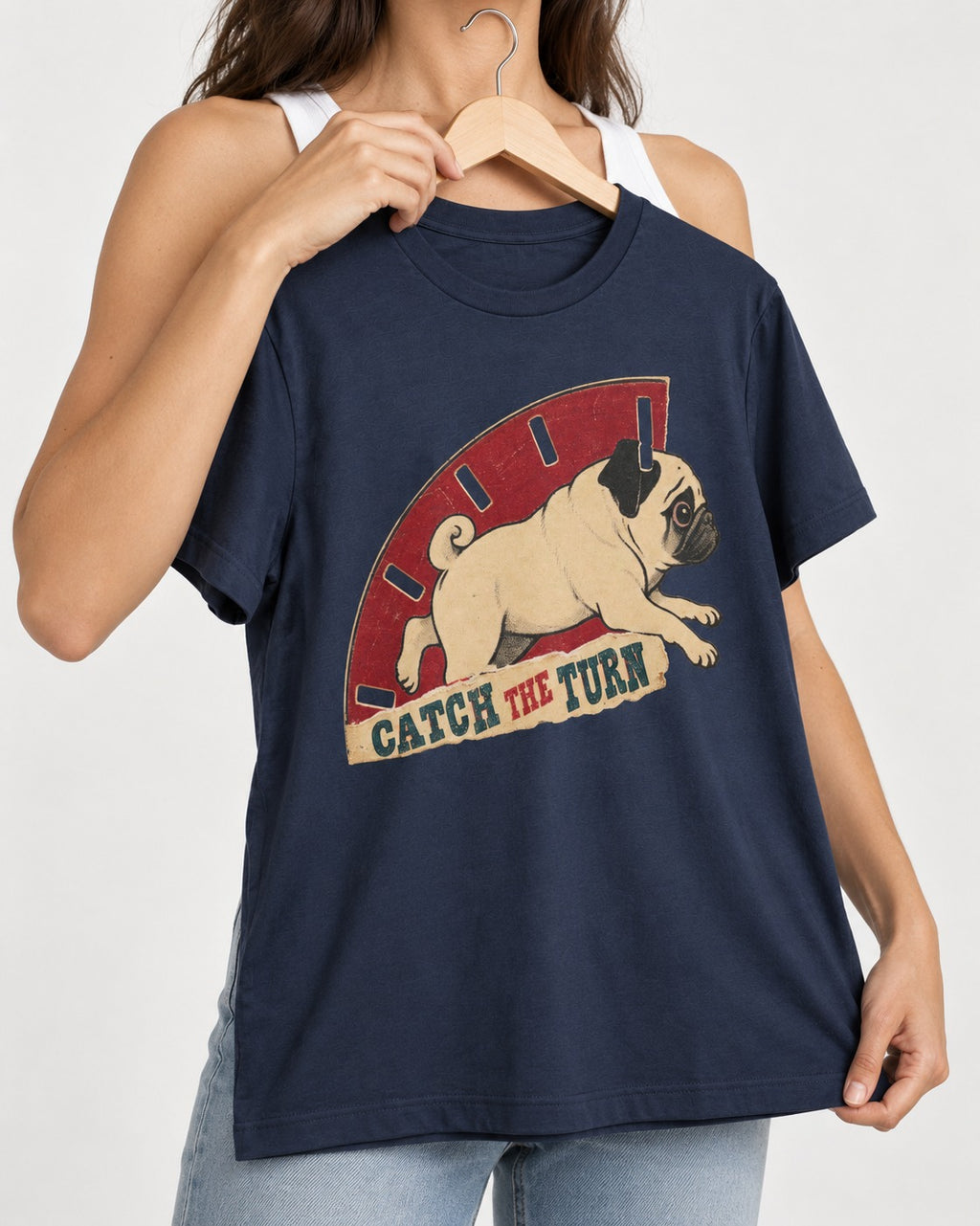 Pug Catch the Turn Track Graphic T-Shirt in Navy, held up on a hanger