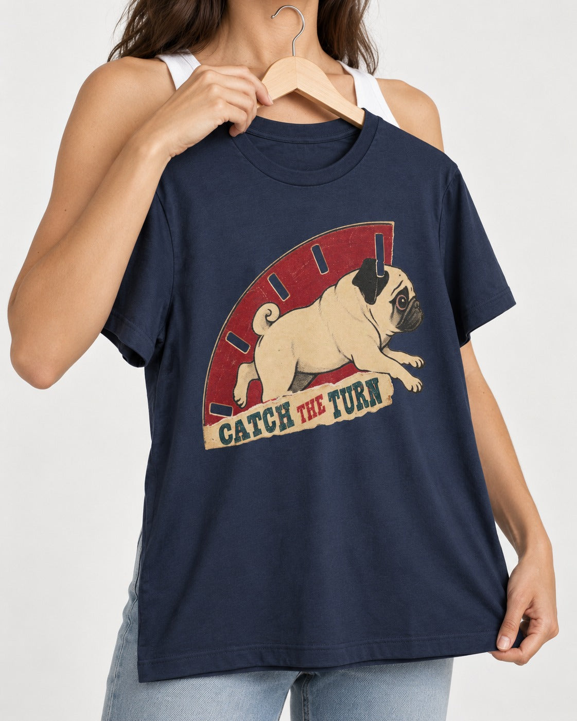Pug Catch the Turn Track Graphic T-Shirt in Navy, held up on a hanger