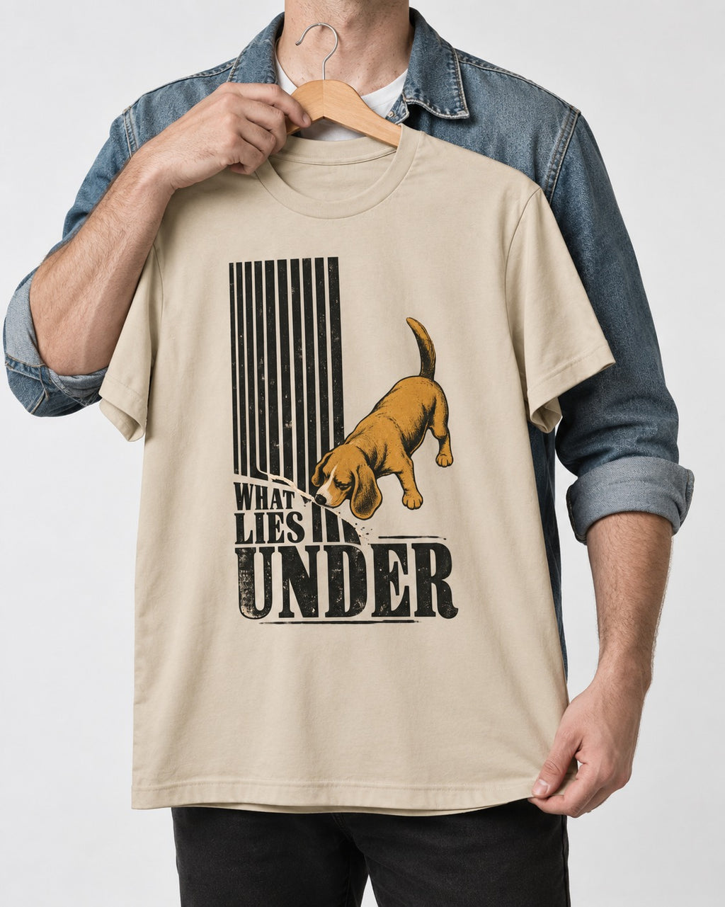 Beagle Knows What Lies Under T-Shirt in Sand, held up on a hanger