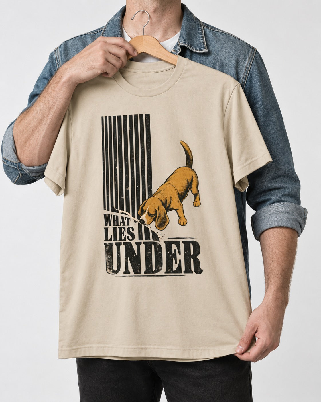 Beagle Knows What Lies Under T-Shirt in Sand, held up on a hanger