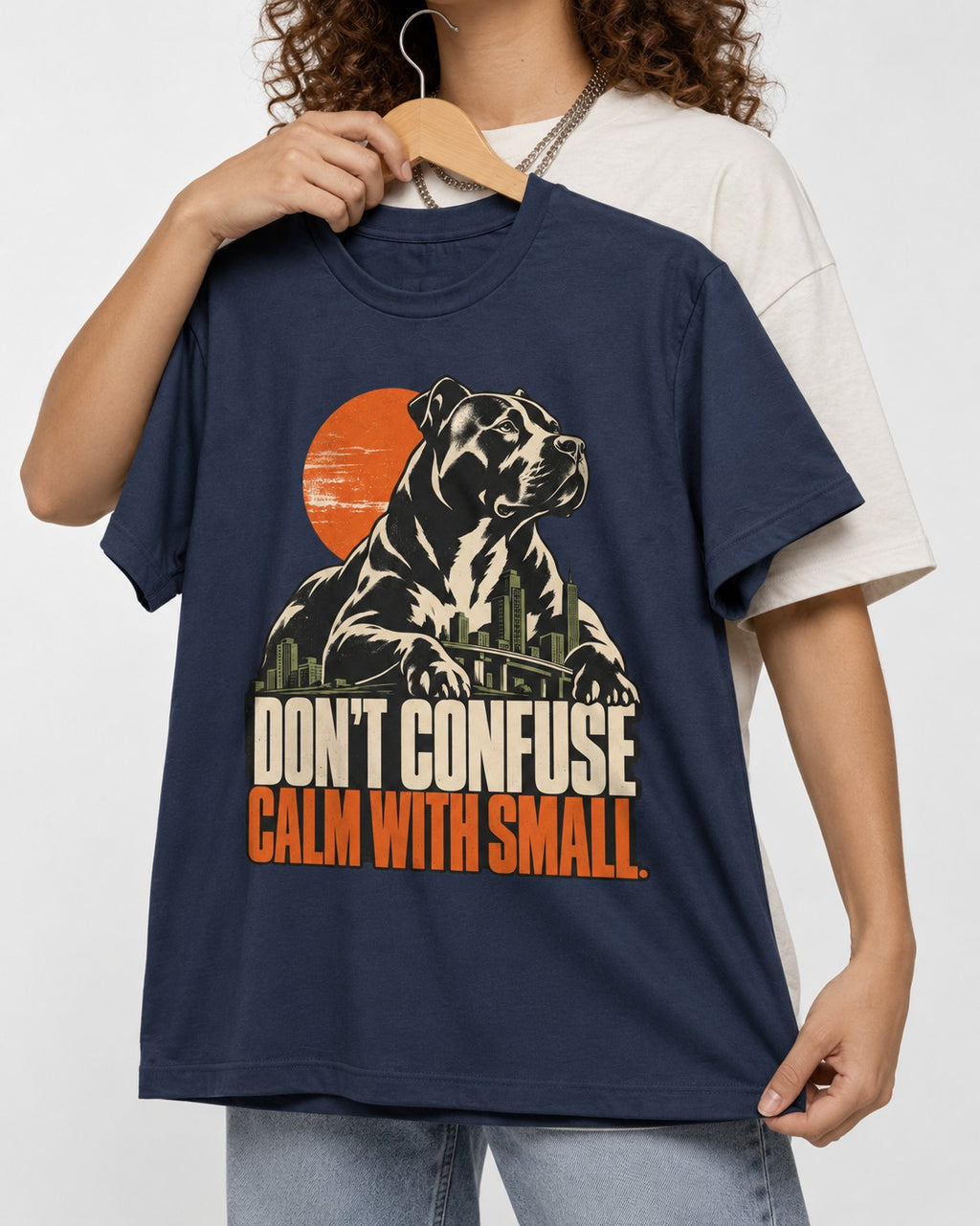 Pitbull Don't Confuse Calm with Small City Guardian Graphic T-Shirt in Navy, held up on a hanger