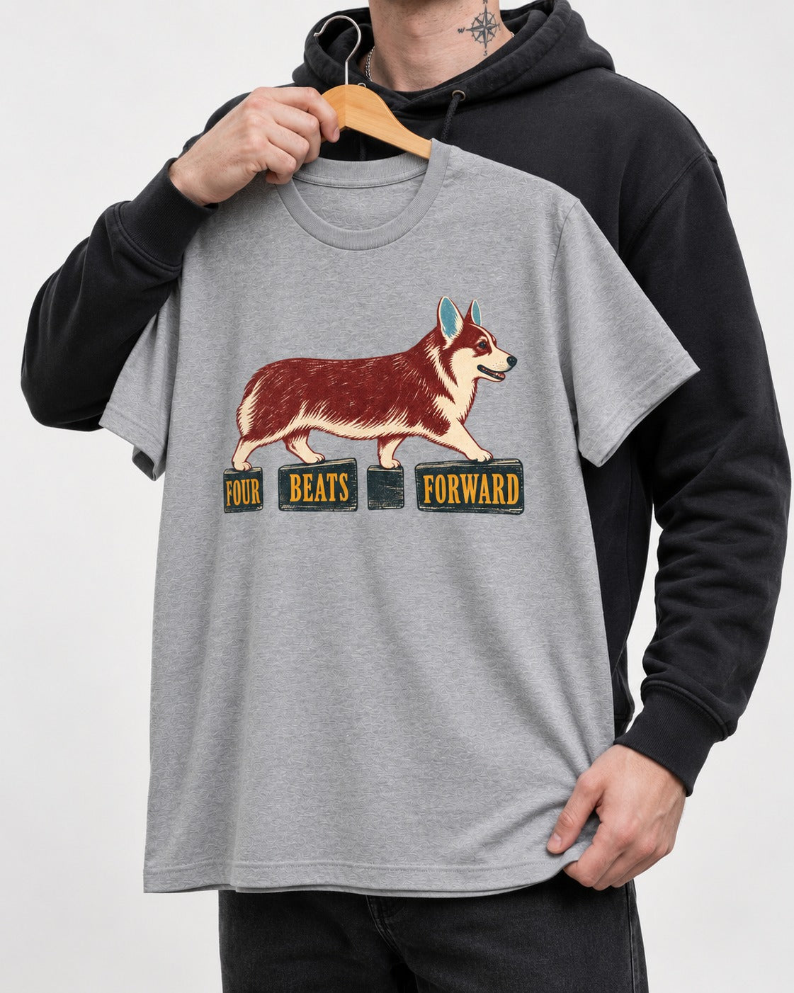 Corgi Four Beats Forward T-Shirt in Sport Grey, held up on a hanger