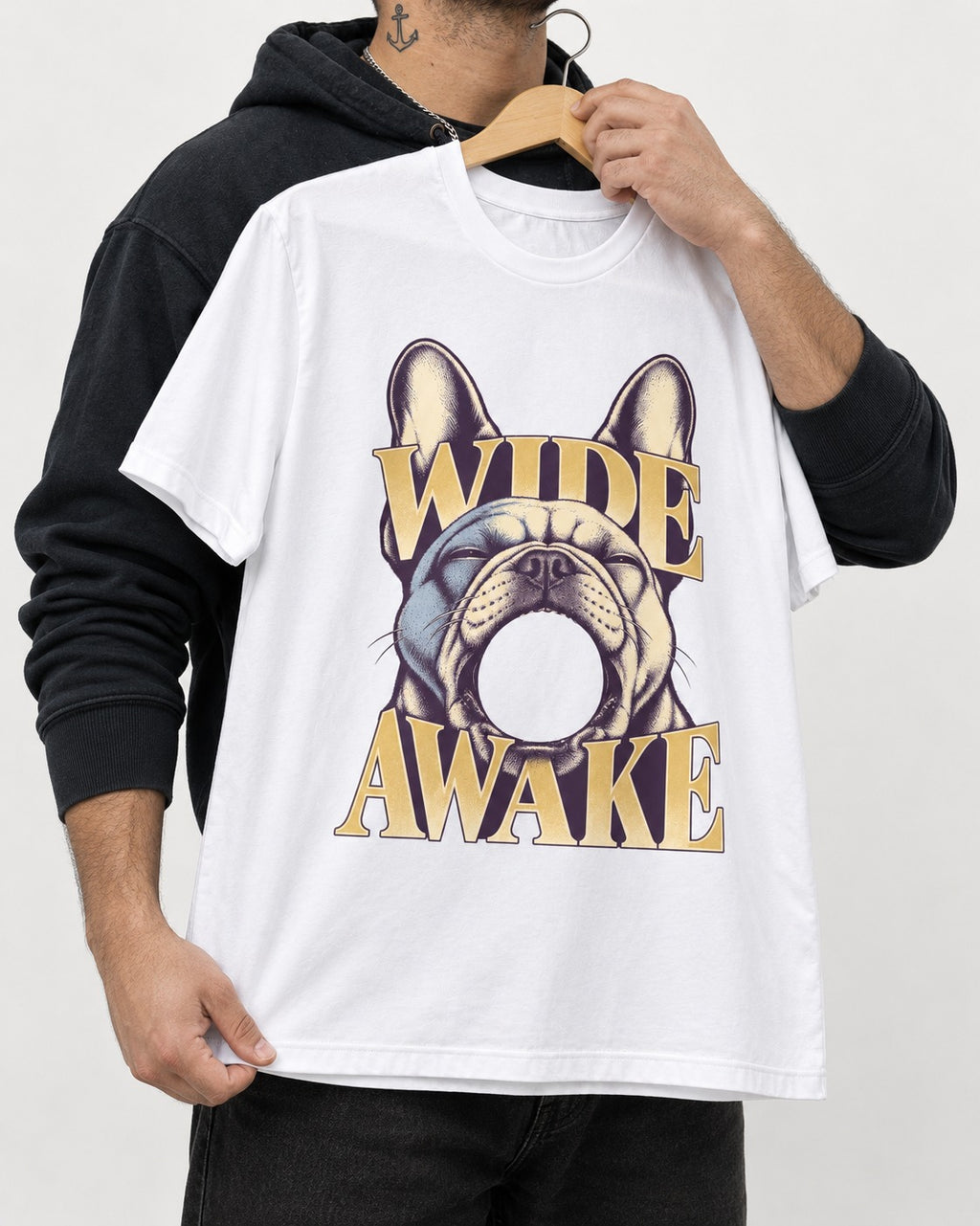 Frenchie Wide Awake Yawn Graphic T-Shirt in White, held up on a hanger