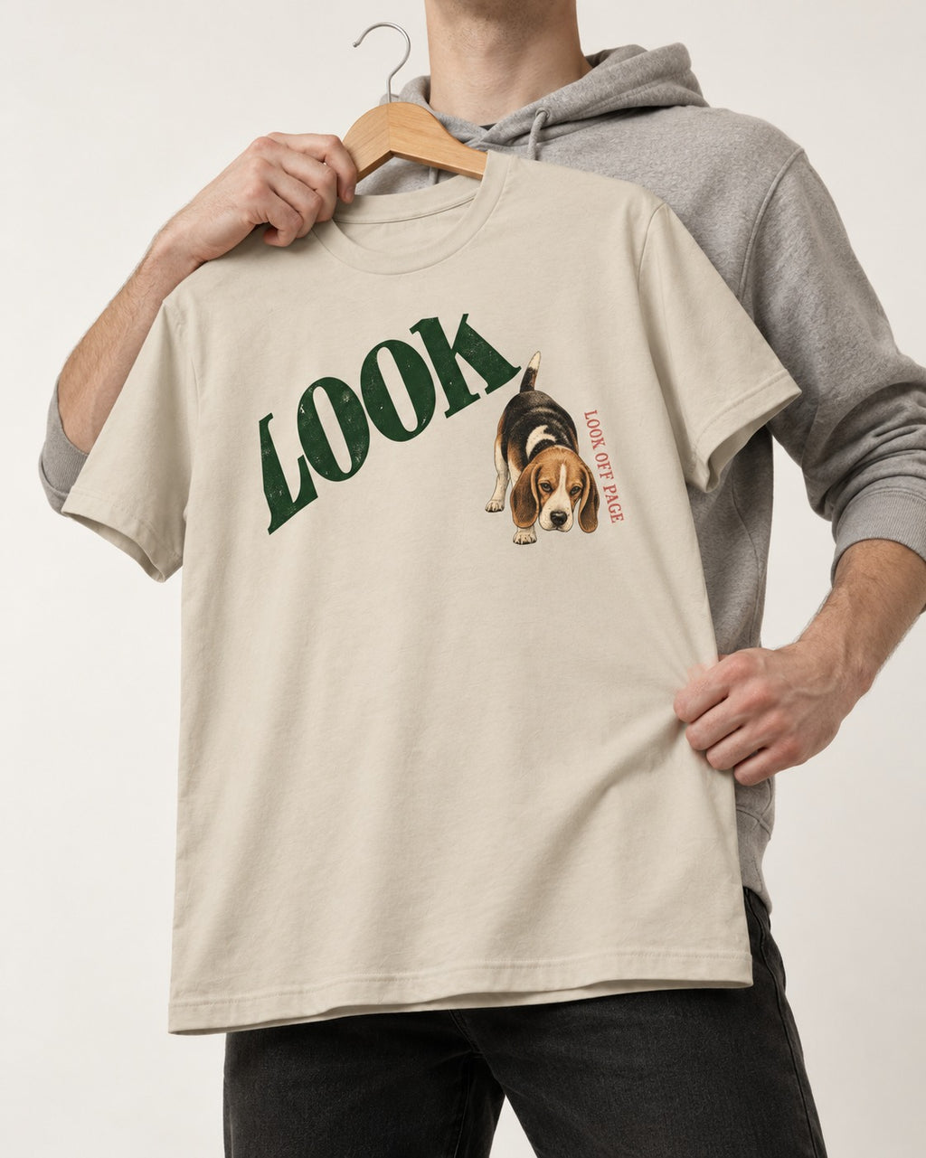 Beagle Look Off Page T-Shirt in Sand, held up on a hanger