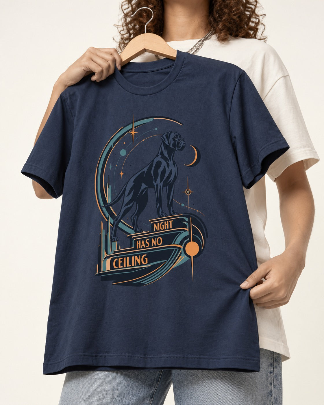 Night Has No Ceiling Boxer Cosmic Graphic T-Shirt in Navy, held up on a hanger