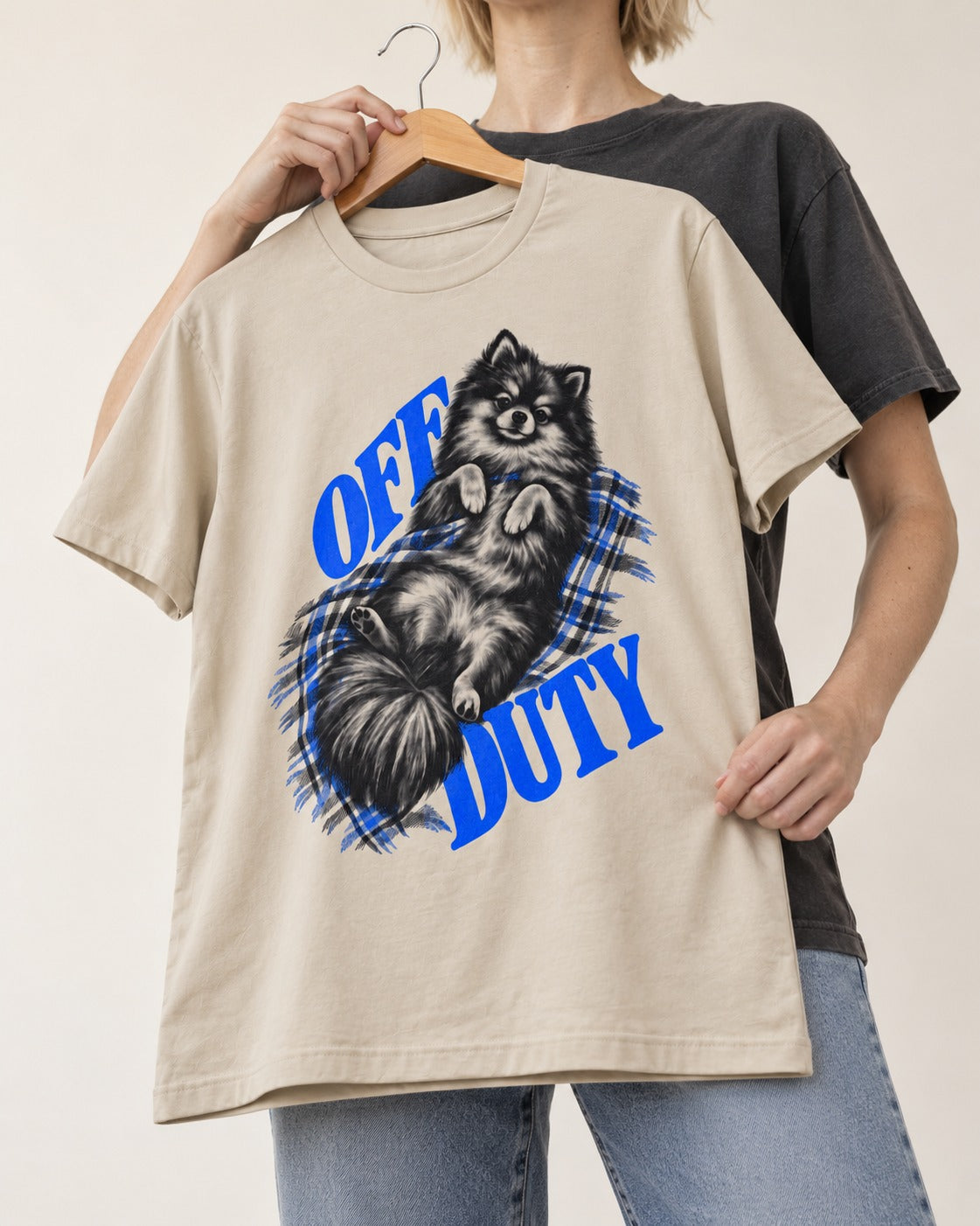 Off Duty Pomeranian T-Shirt in Sand, held up on a hanger