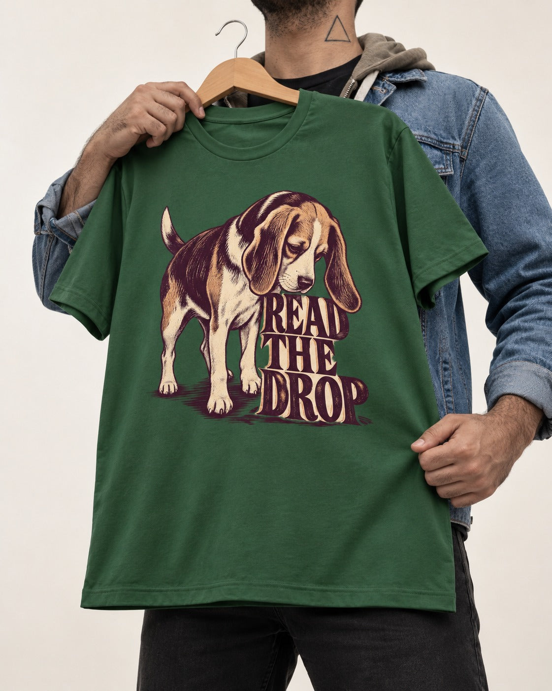 Beagle Read The Drop T-Shirt in Forest Green, held up on a hanger