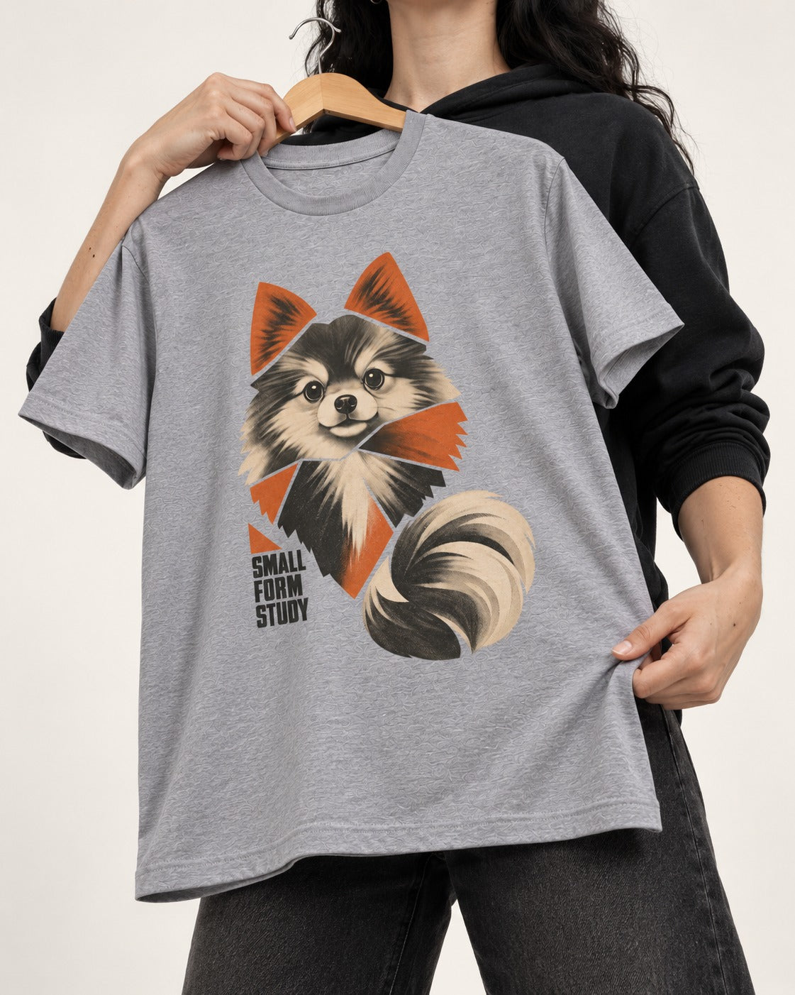 Pomeranian Small Form Study T-Shirt in Sport Grey, held up on a hanger
