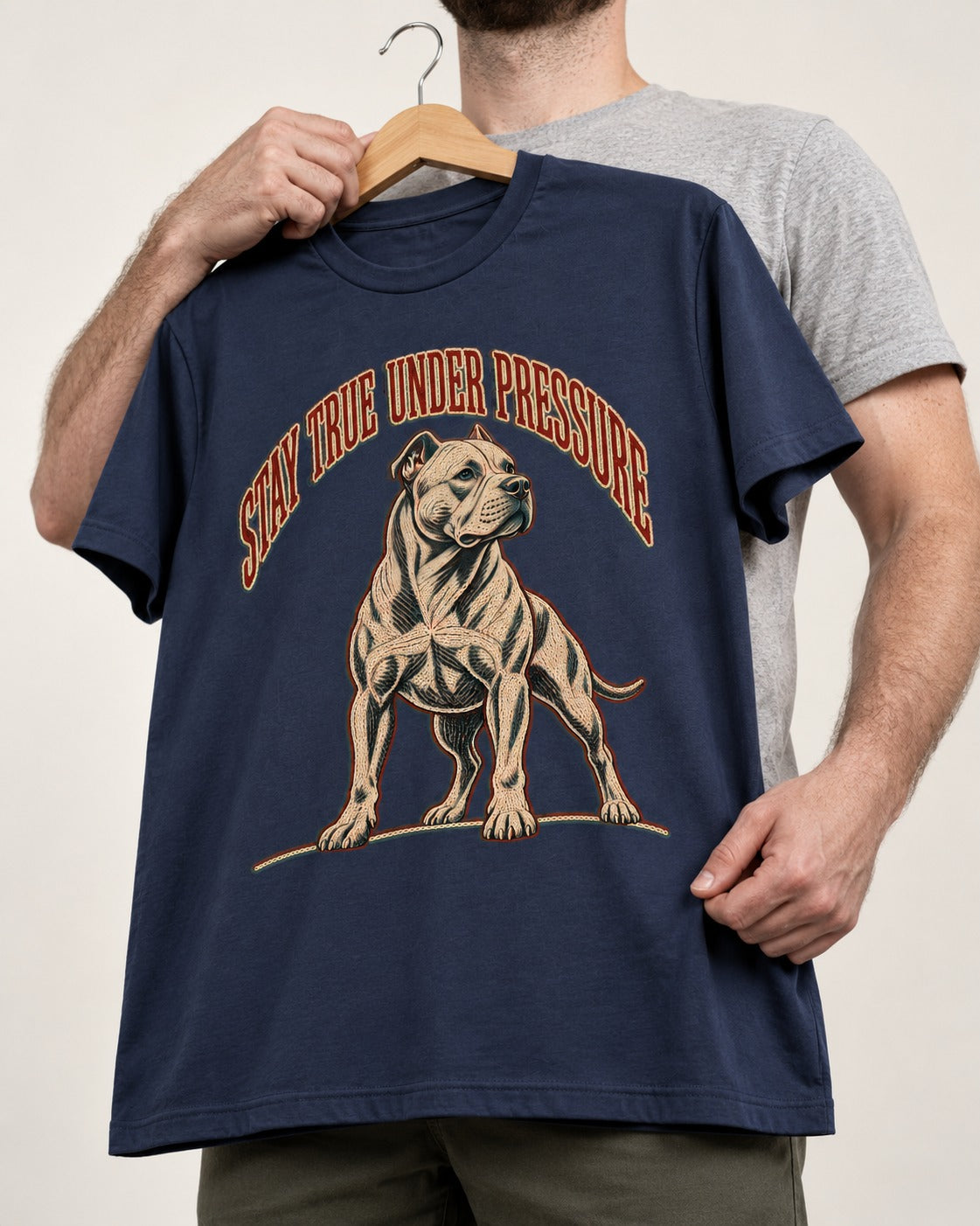 Pitbull Stay True Under Pressure Stance Graphic T-Shirt in Navy, held up on a hanger