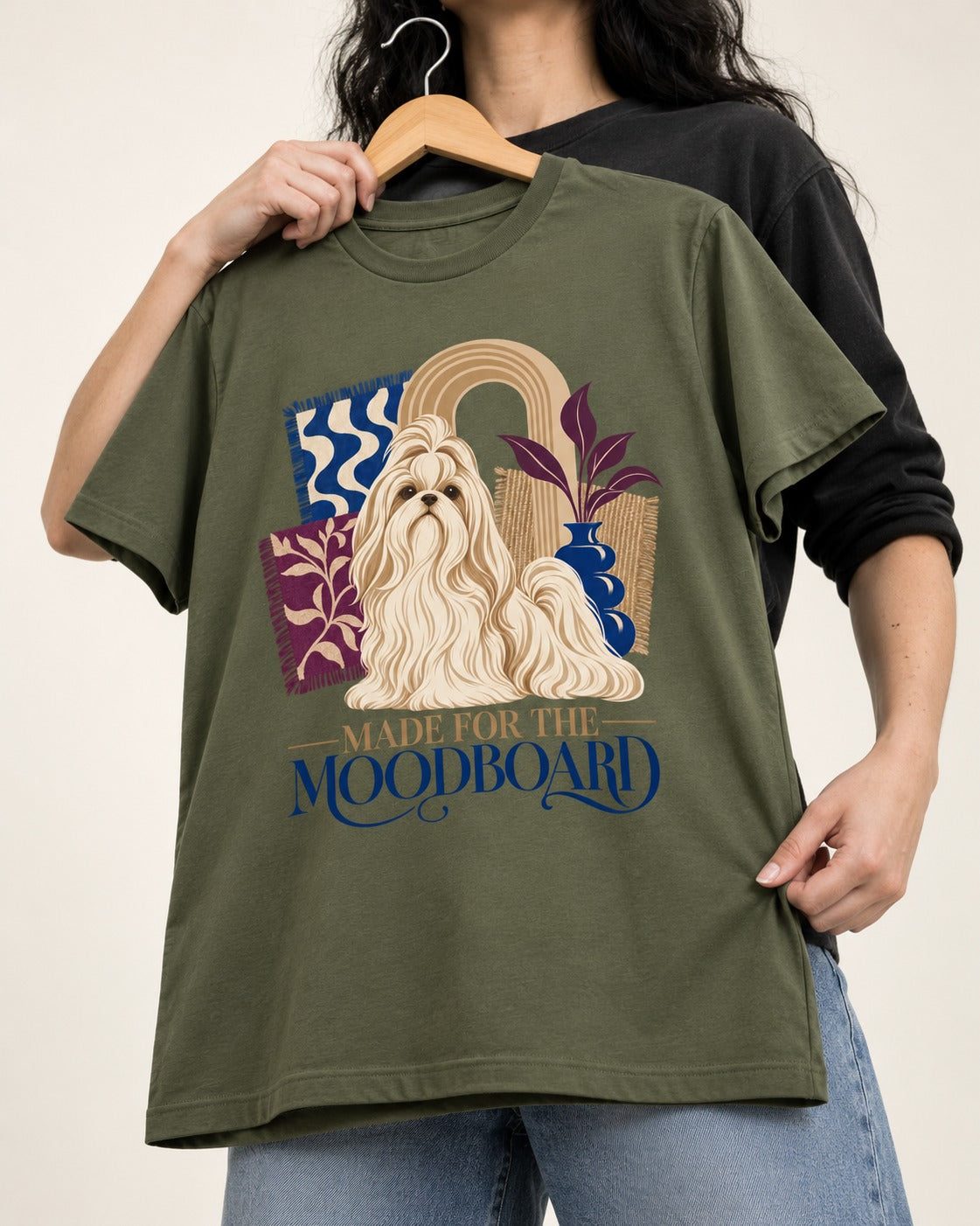Shih Tzu Made for the Moodboard Boho Interior Graphic T-Shirt in Heather Military Green, held up on a hanger