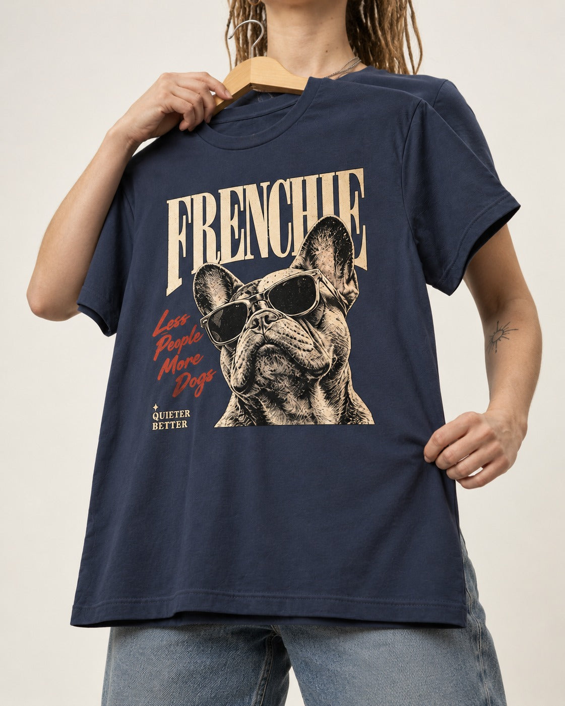 Frenchie Less People More Dogs Sunglasses Graphic T-Shirt in Navy, held up on a hanger