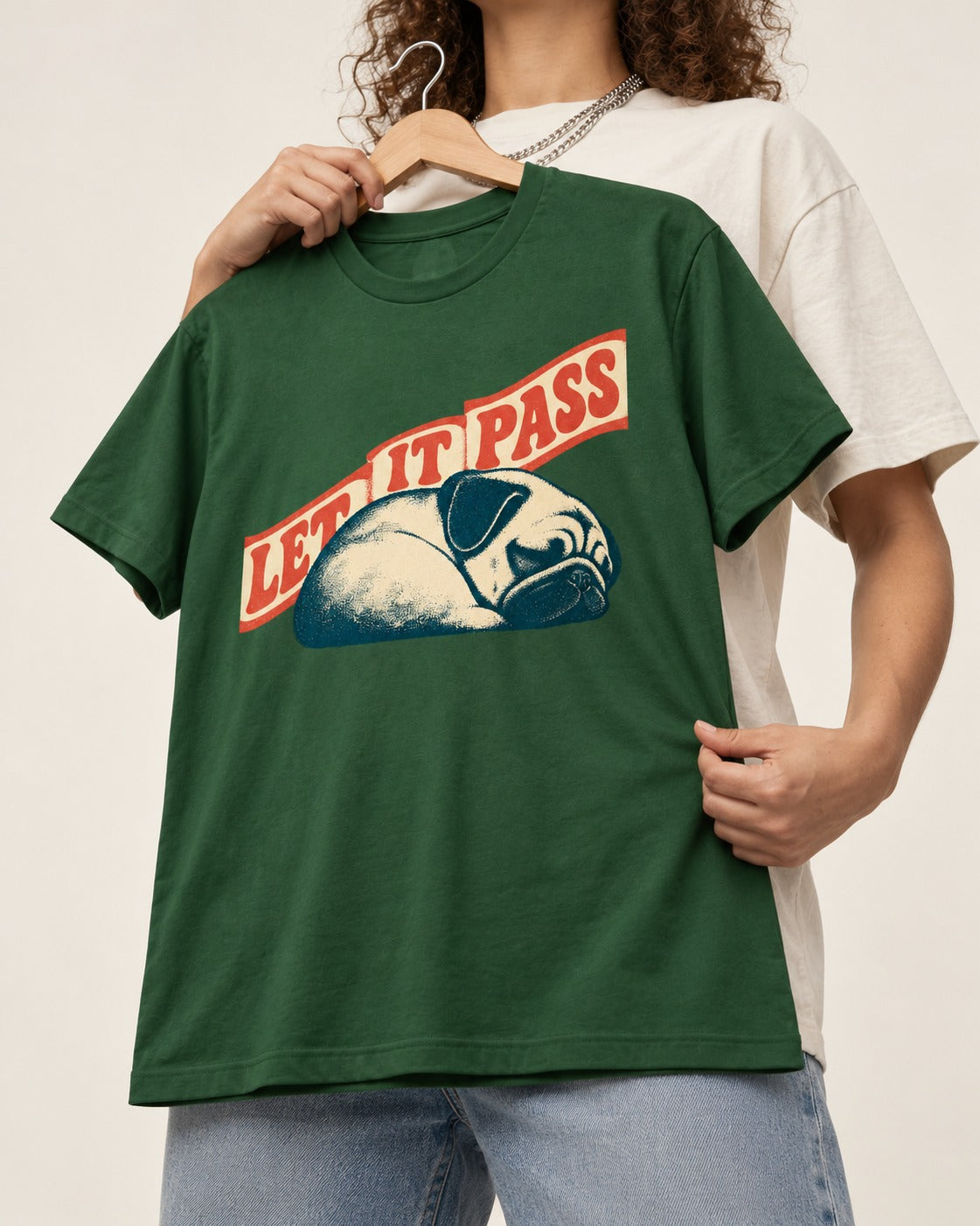 Pug Let It Pass Sleeping Banner Graphic T-Shirt in Forest Green, held up on a hanger