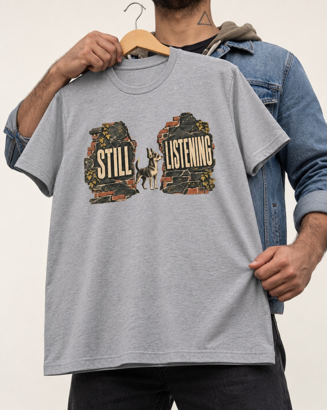 Chihuahua Still Listening T-Shirt in Sport Grey, held up on a hanger