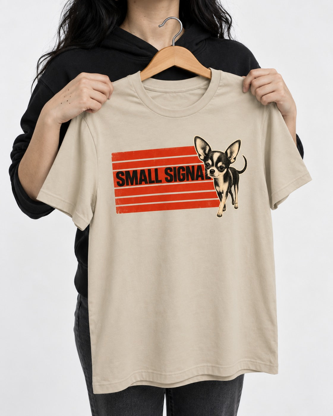 Small Signal Chihuahua T-Shirt in Sand, held up on a hanger