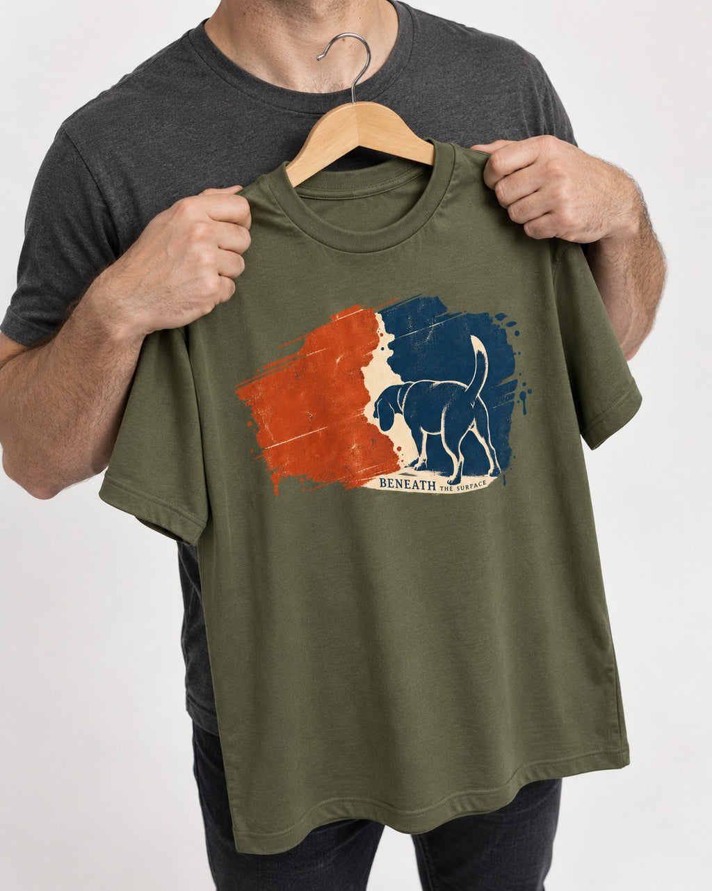 Beagle Beneath The Surface Scent Trail T-Shirt in Heather Military Green, held up on a hanger