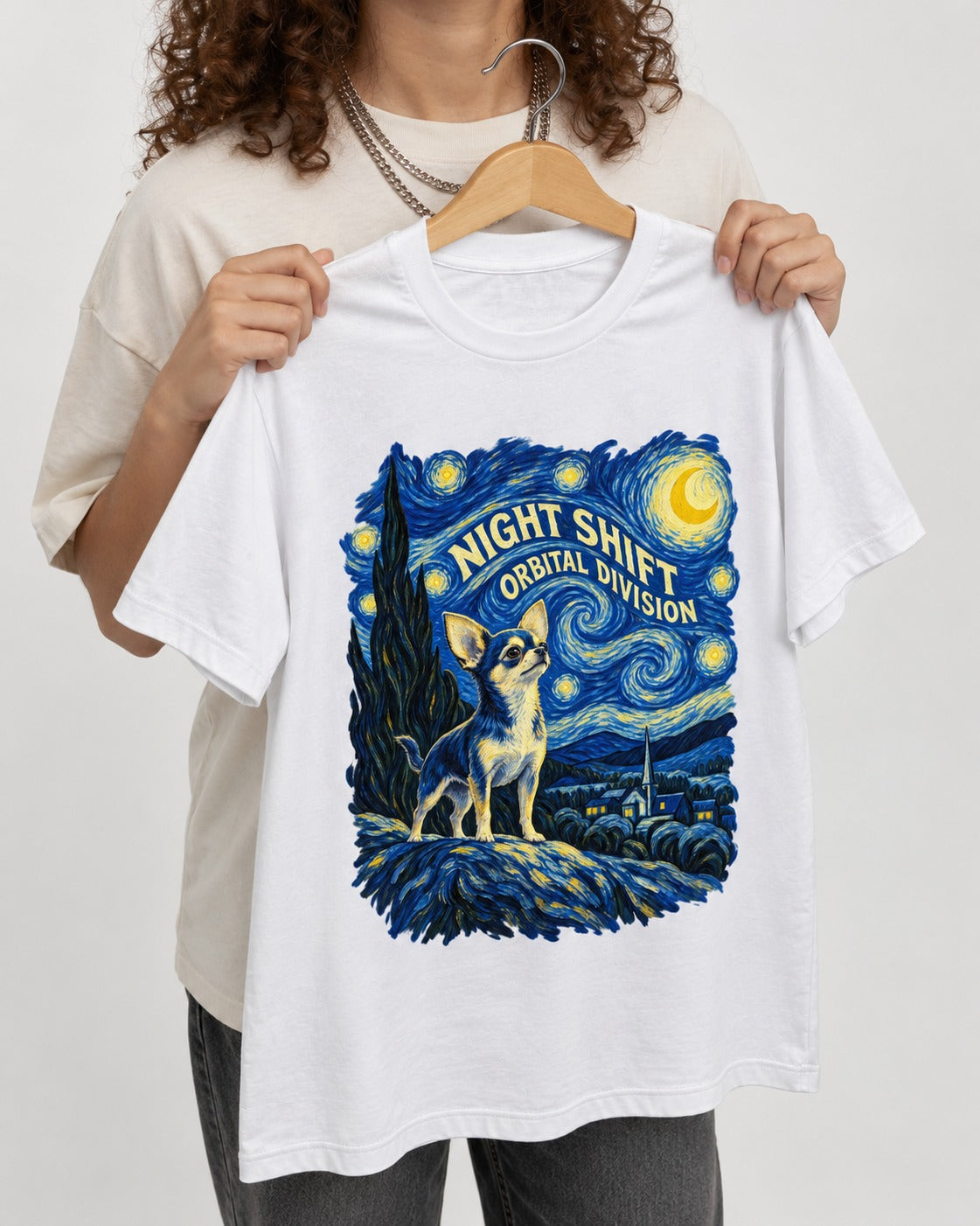 Chihuahua Night Shift Orbital Division Starry Night Graphic T-Shirt in White, held up on a hanger