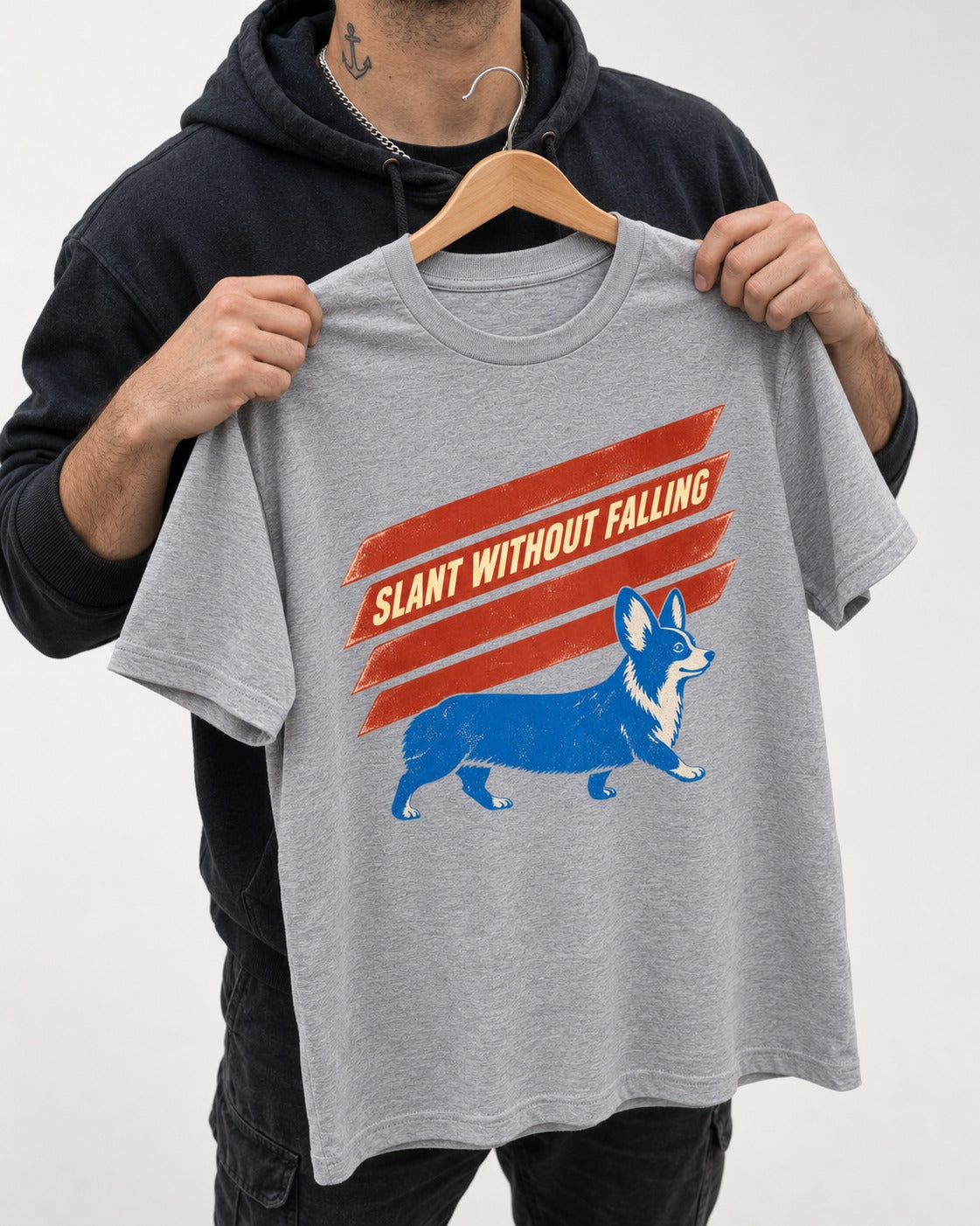 Corgi Slant Without Falling Speed Graphic T-Shirt in Sport Grey, held up on a hanger