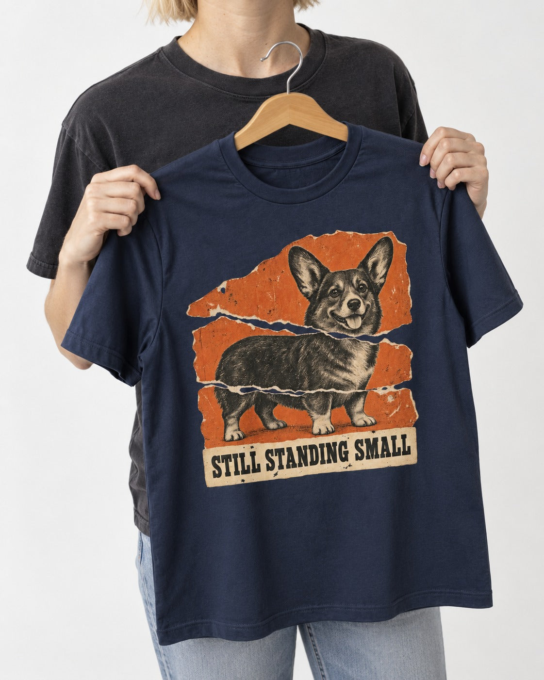 Corgi Still Standing Small Torn Poster T-Shirt in Navy, held up on a hanger