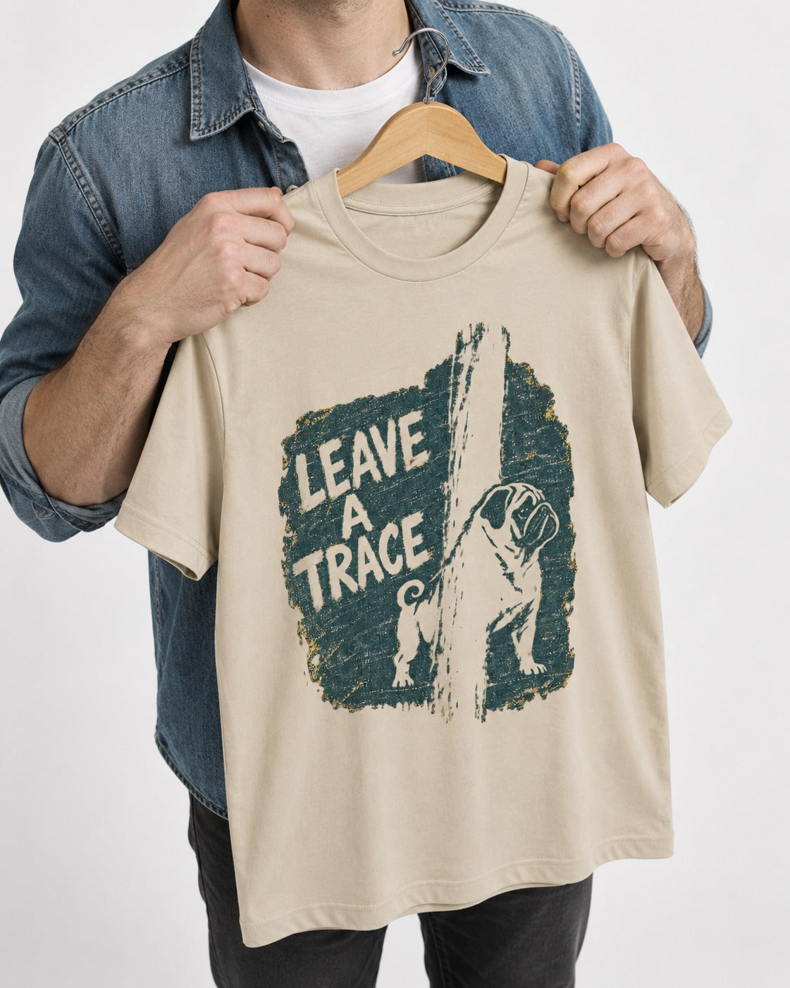 Pug Leaves a Trace T-Shirt in Sand, held up on a hanger