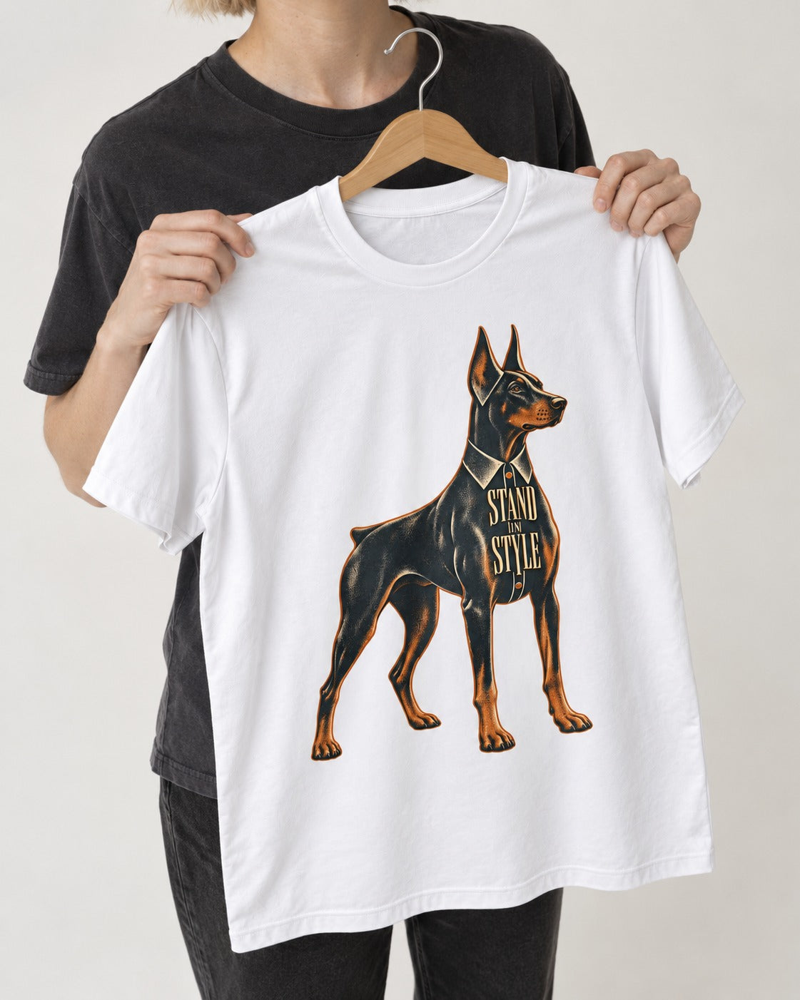 Doberman Stand in Style Suit Graphic T-Shirt in White, held up on a hanger