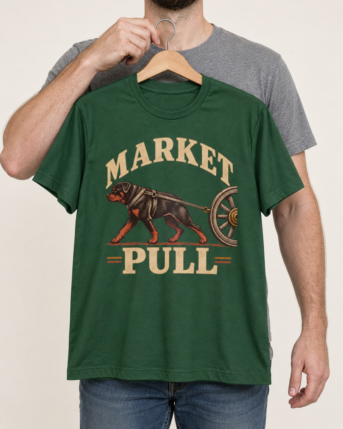 Market Pull Rottweiler Cart Harness Graphic T-Shirt in Forest Green, held up on a hanger