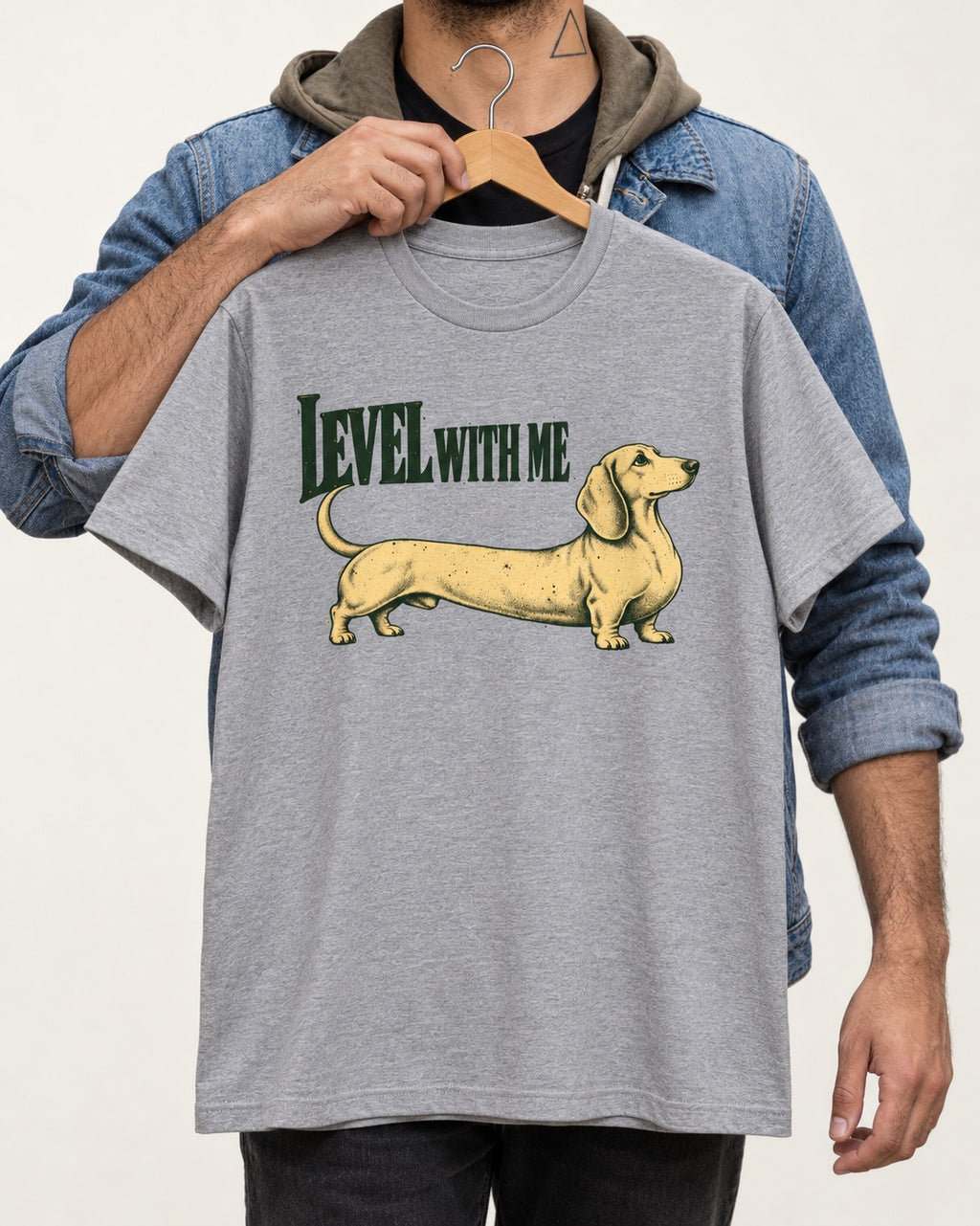 Dachshund Level with Me T-Shirt in Sport Grey, held up on a hanger