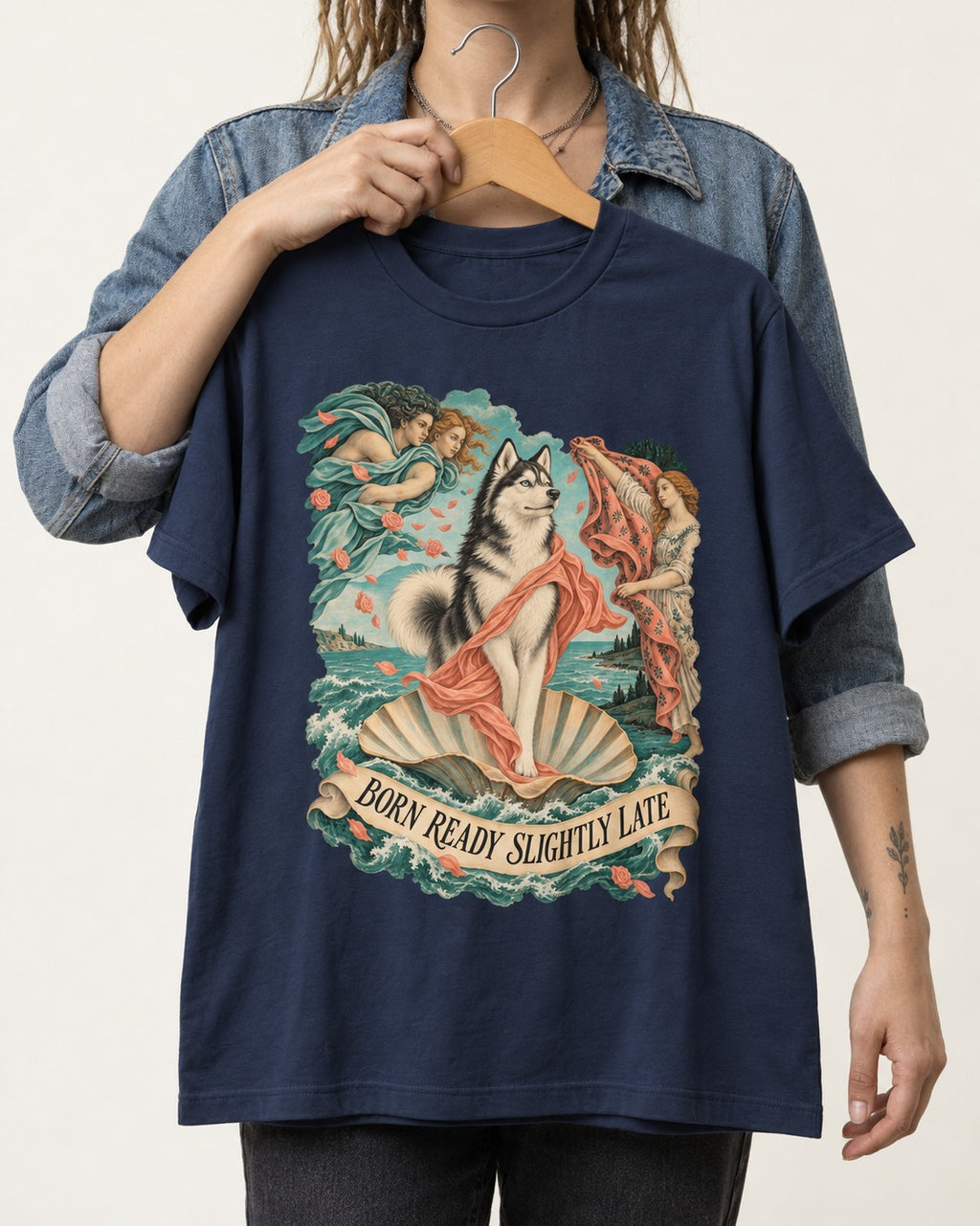 Husky Born Ready Slightly Late Renaissance Graphic T-Shirt in Navy, held up on a hanger