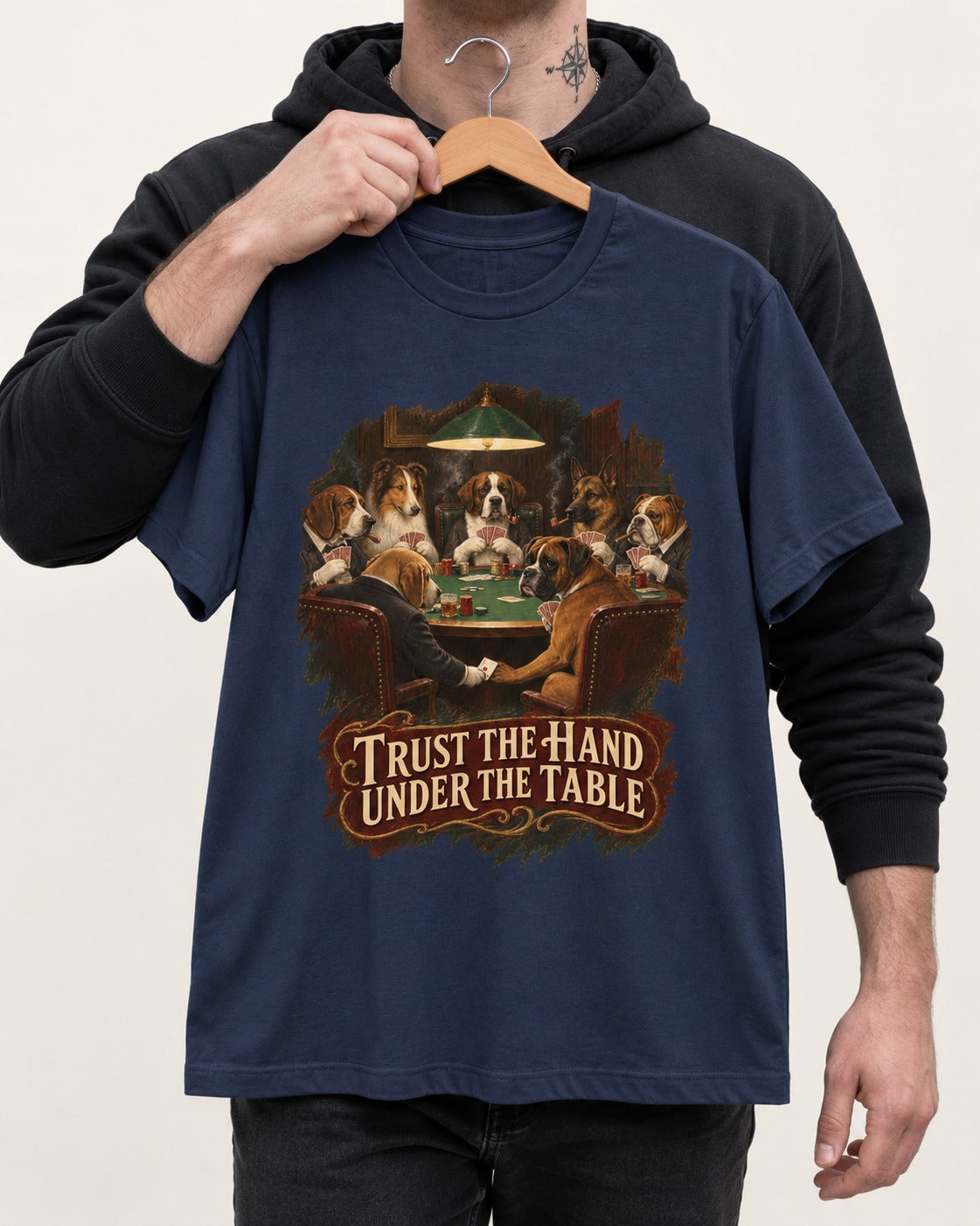 Trust the Hand Under the Table Boxer Poker Graphic T-Shirt in Navy, held up on a hanger