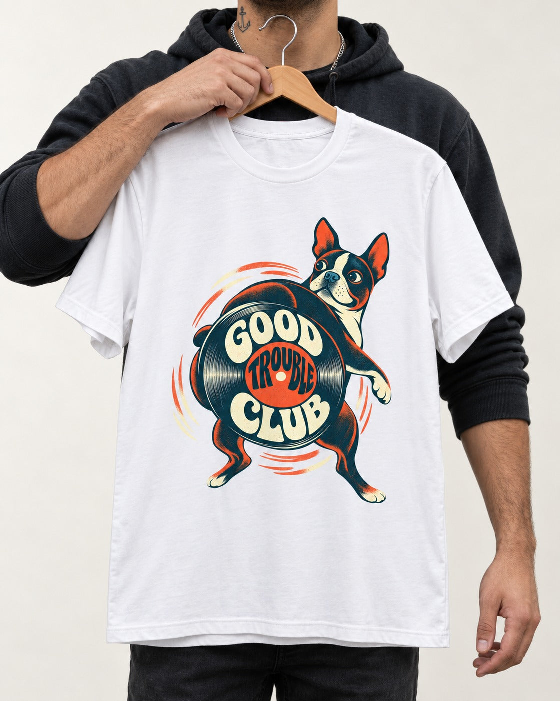Good Trouble Club Boston Terrier T-Shirt in White, held up on a hanger