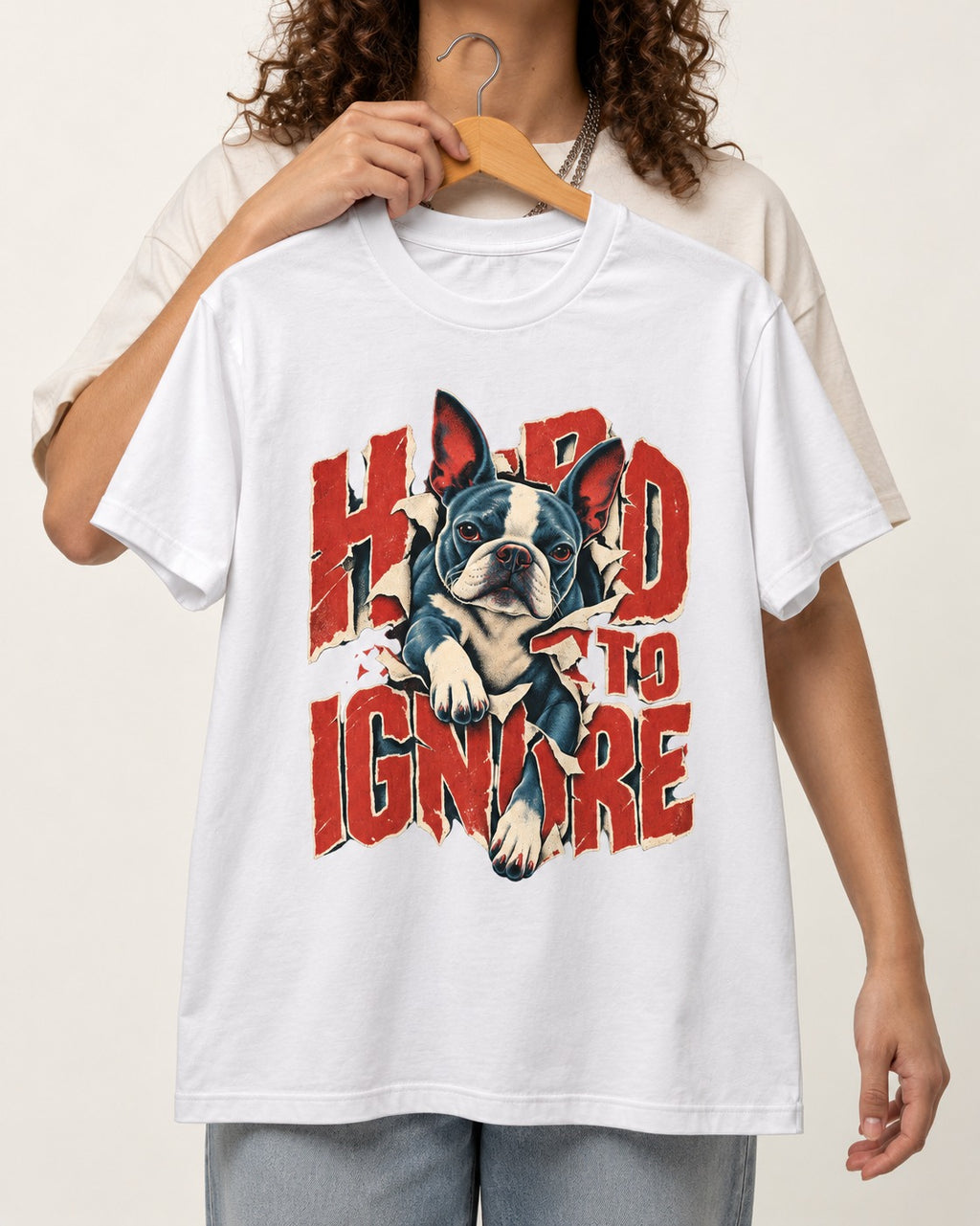 Hard to Ignore Boston Terrier Graphic T-Shirt in White, held up on a hanger