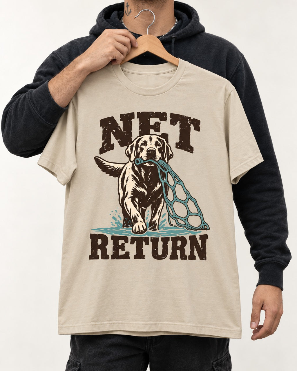 Net Return Labrador Retriever T-Shirt in Sand, held up on a hanger