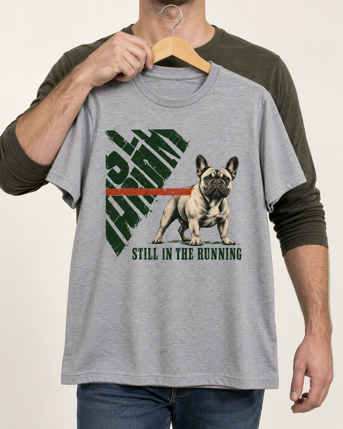 Frenchie Still in the Running T-Shirt in Sport Grey, held up on a hanger