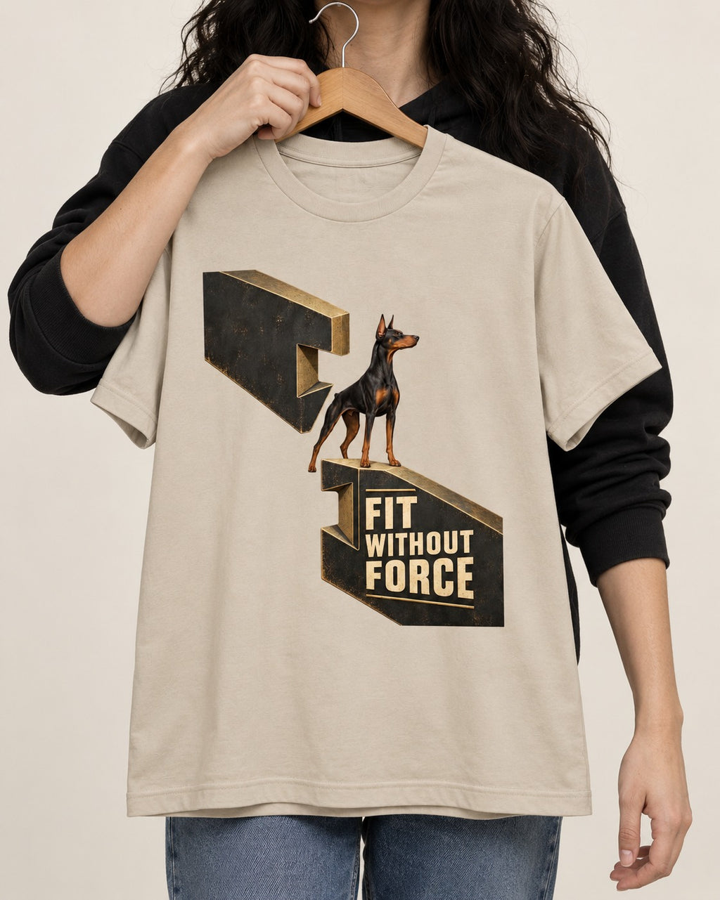 Doberman Fit Without Force T-Shirt in Sand, held up on a hanger