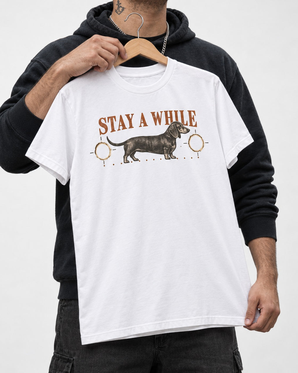 Dachshund Stay A While Ornamental Portrait Graphic T-Shirt in White, held up on a hanger