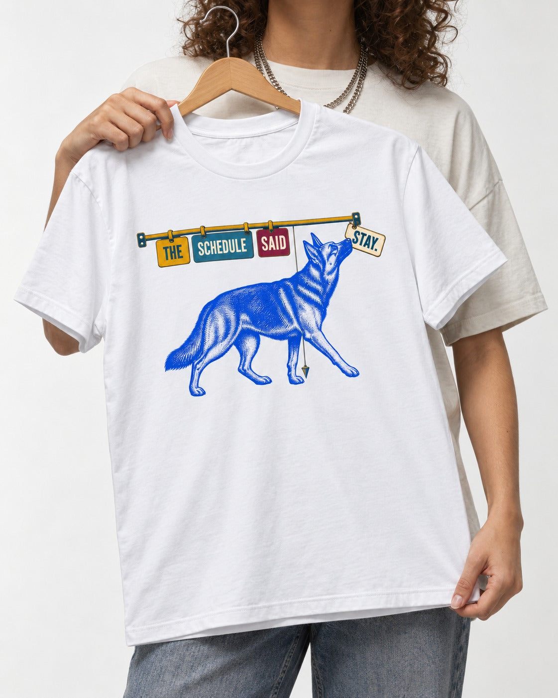 German Shepherd Dog The Schedule Said Stay Graphic T-Shirt in White, held up on a hanger