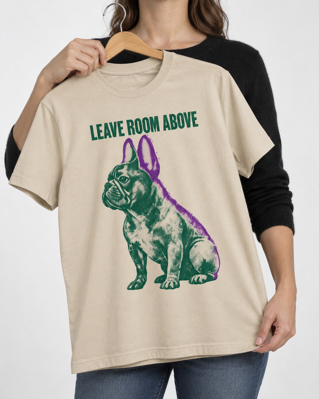 Leave Room Above Frenchie T-Shirt in Sand, held up on a hanger