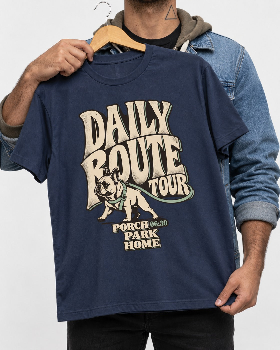 Frenchie Daily Route Tour Graphic T-Shirt in Navy, held up on a hanger