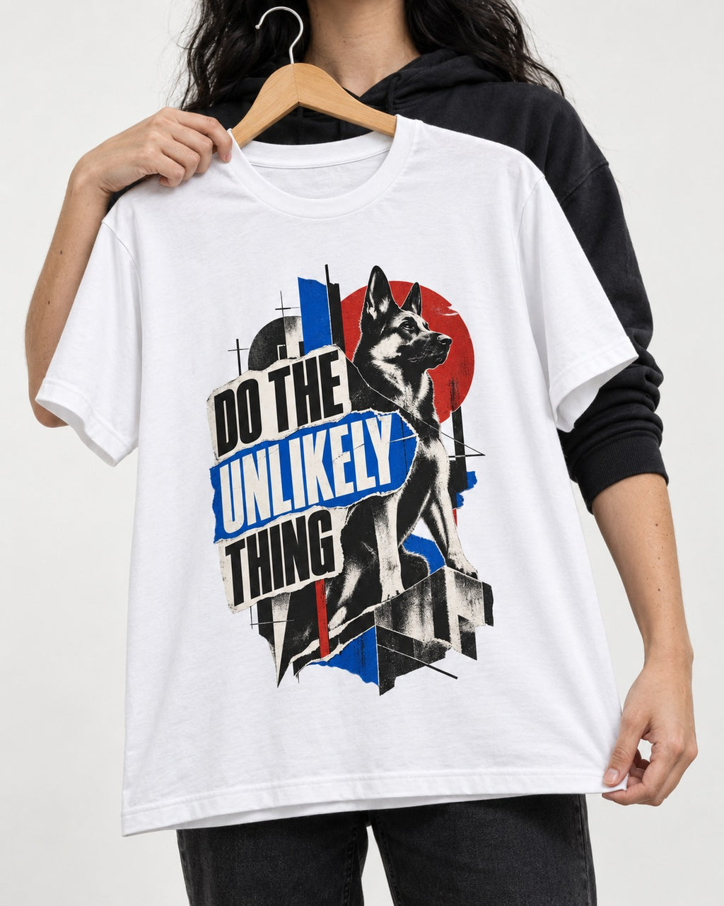 Do The Unlikely Thing Torn Poster German Shepherd Dog Graphic T-Shirt in White, held up on a hanger