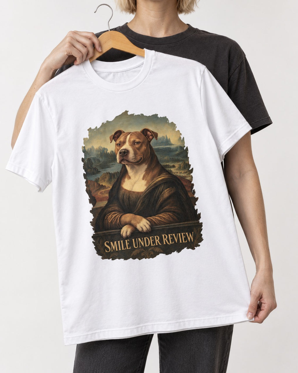 Pitbull Smile Under Review Renaissance Portrait Graphic T-Shirt in White, held up on a hanger