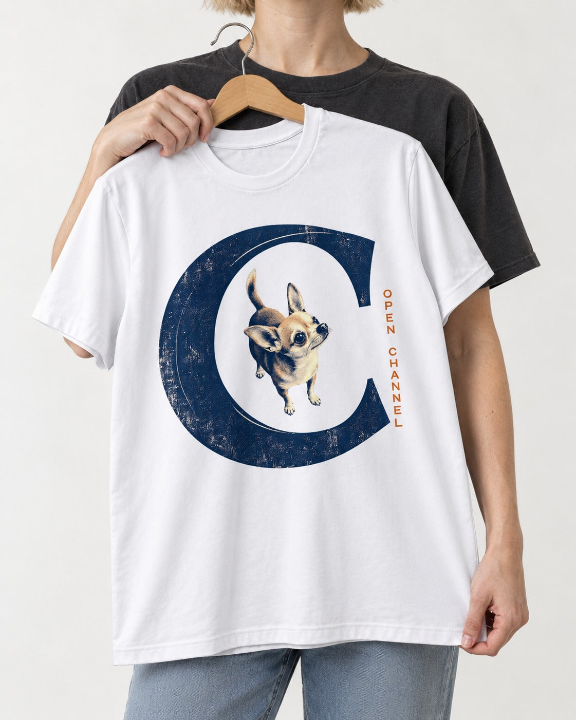 Chihuahua Open Channel T-Shirt in White, held up on a hanger