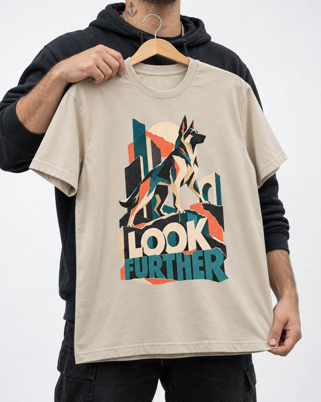 Look Further German Shepherd Dog T-Shirt in Sand, held up on a hanger