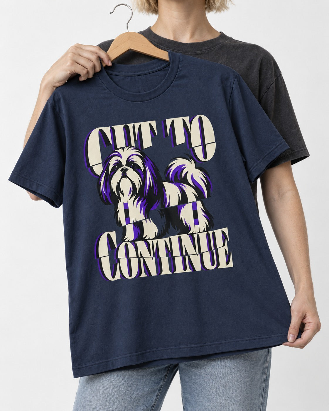 Shih Tzu Cut to Continue Dimensional Typography Graphic T-Shirt in Navy, held up on a hanger
