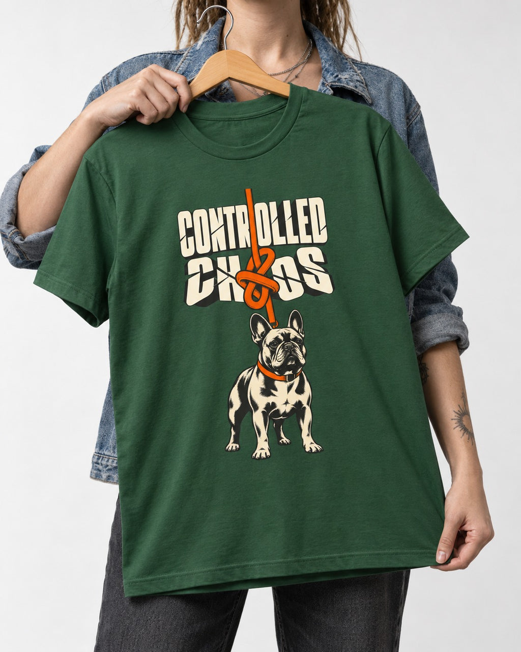 Frenchie Controlled Chaos Leash Knot Graphic T-Shirt in Forest Green, held up on a hanger