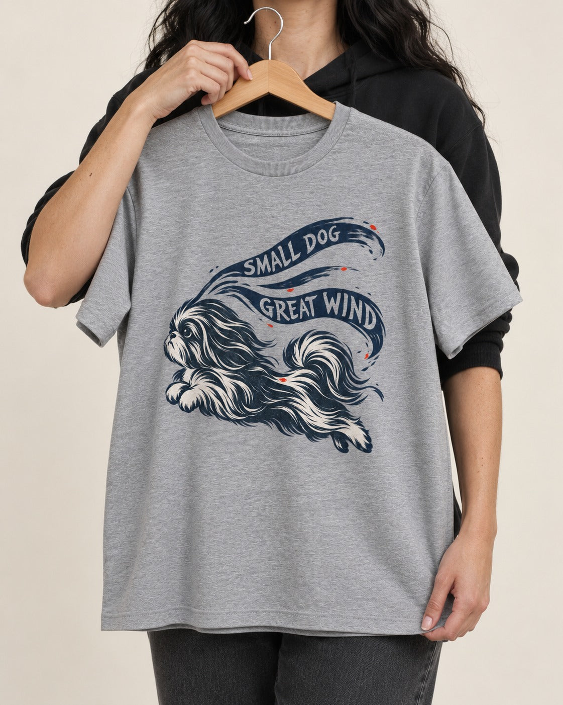 Small Shih Tzu Great Wind T-Shirt in Sport Grey, held up on a hanger