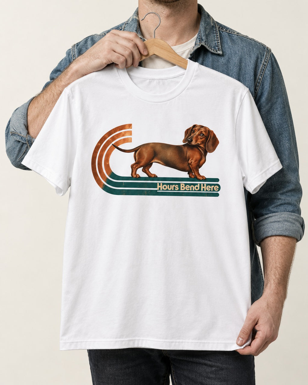 Dachshund Hours Bend Here Retro Track Graphic T-Shirt in White, held up on a hanger