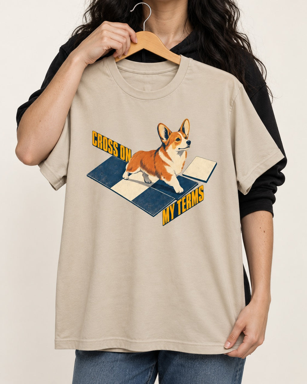 Corgi On My Terms T-Shirt in Sand, held up on a hanger