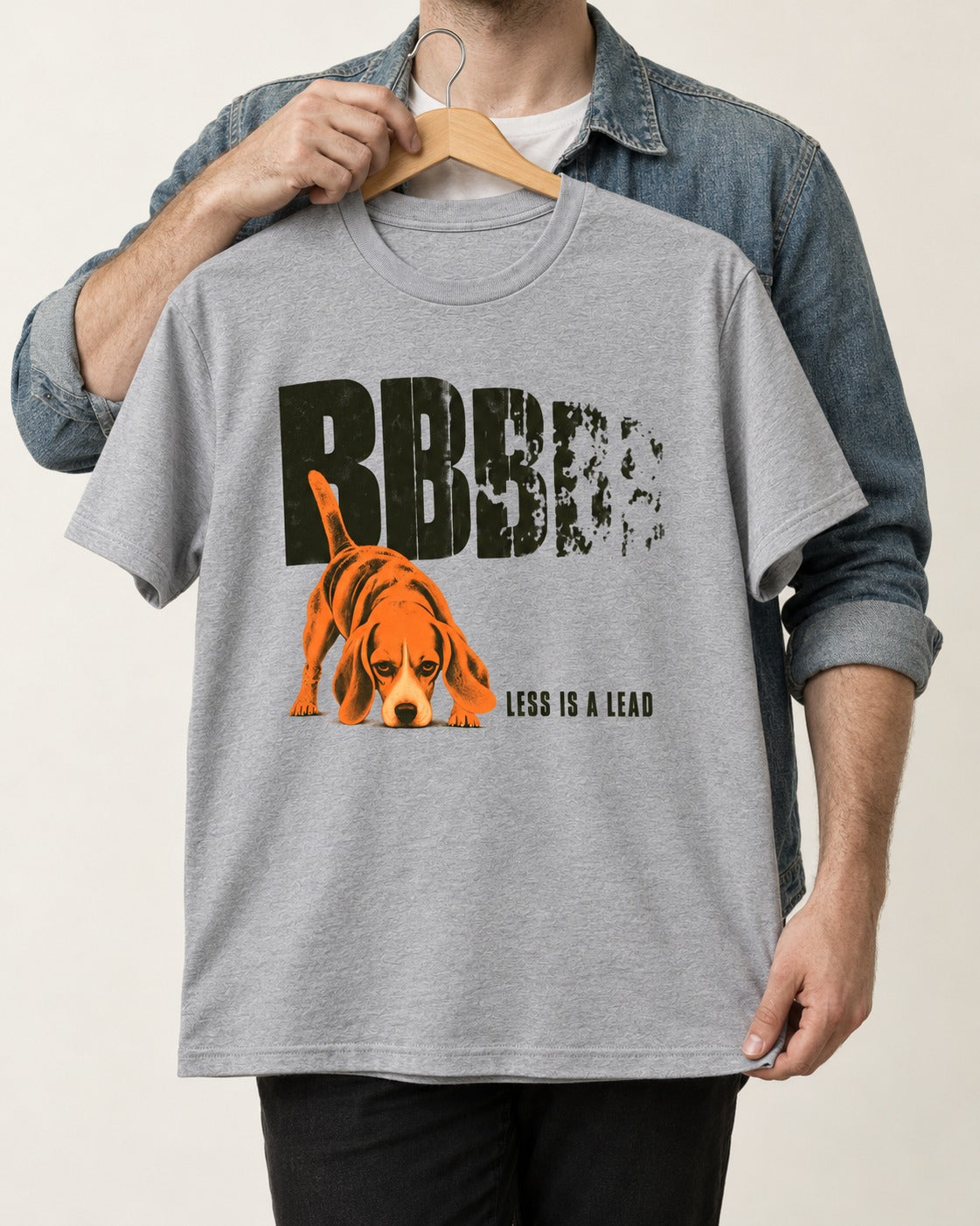 Less Is a Lead Beagle T-Shirt in Sport Grey, held up on a hanger