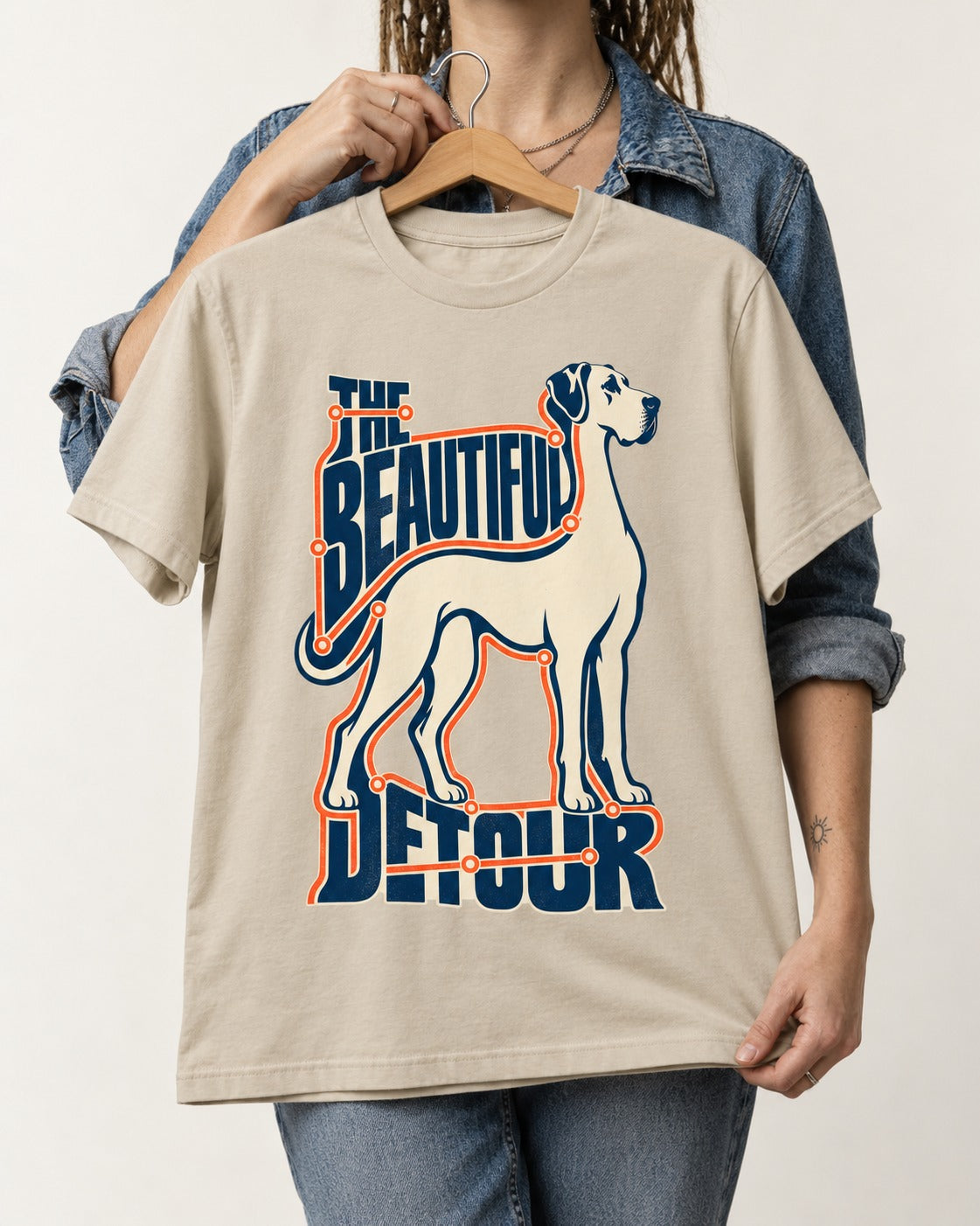 Great Dane's Beautiful Detour T-Shirt in Sand, held up on a hanger