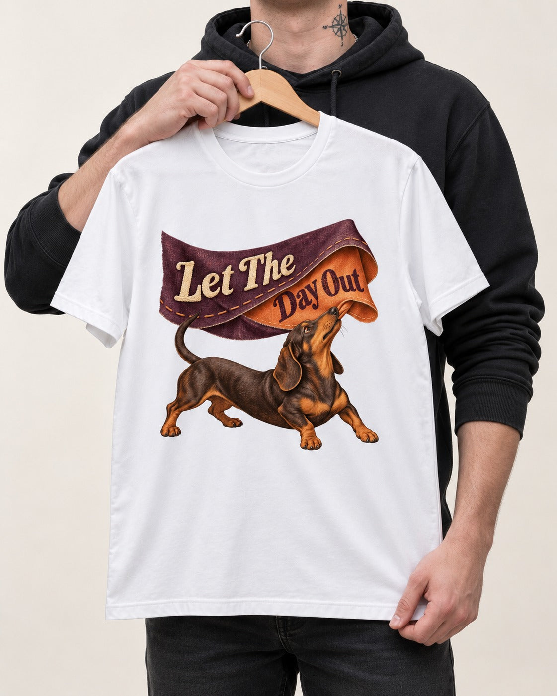Dachshund Let The Day Out Fabric Banner Graphic T-Shirt in White, held up on a hanger