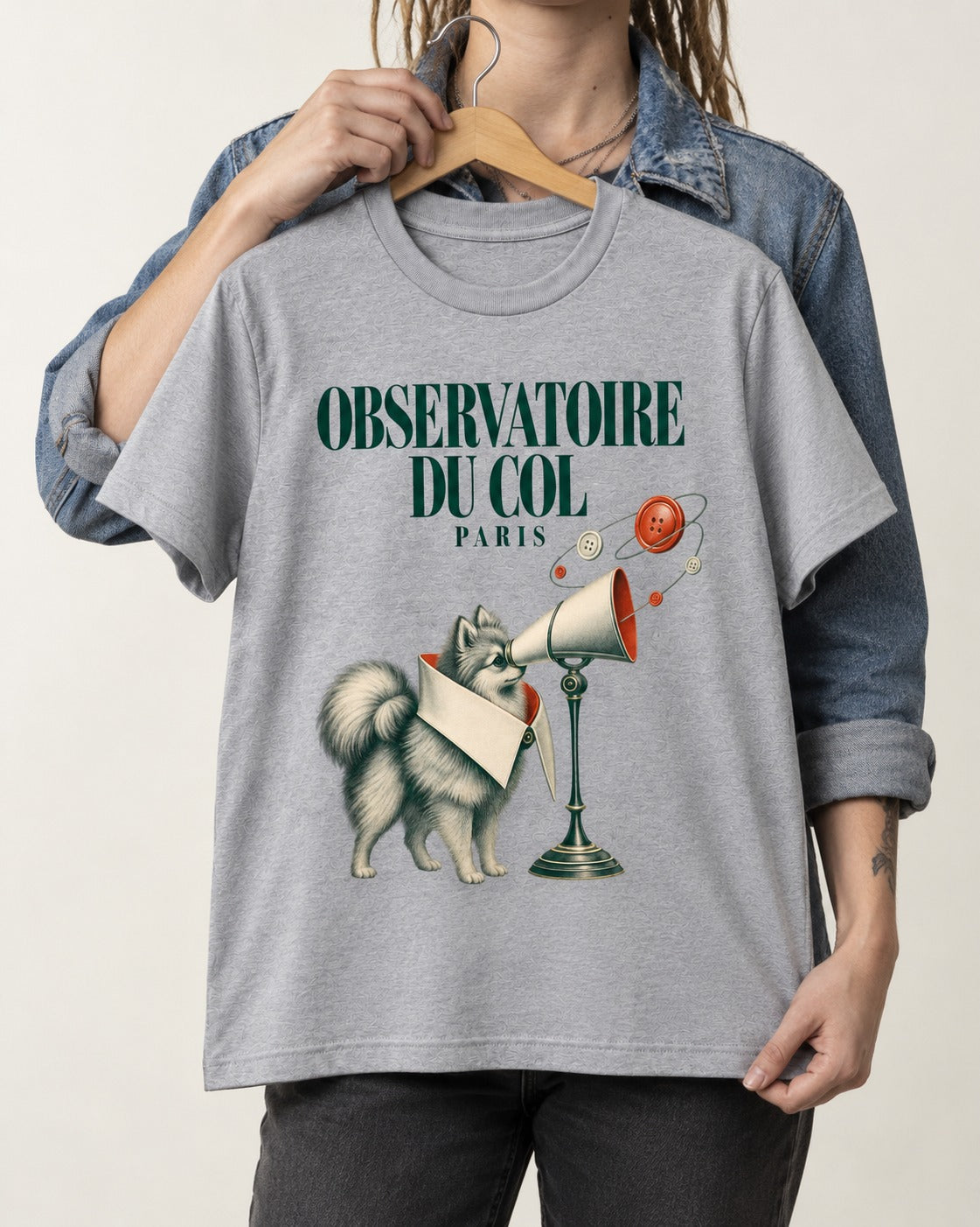 Pomeranian Observatoire Du Col T-Shirt in Sport Grey, held up on a hanger